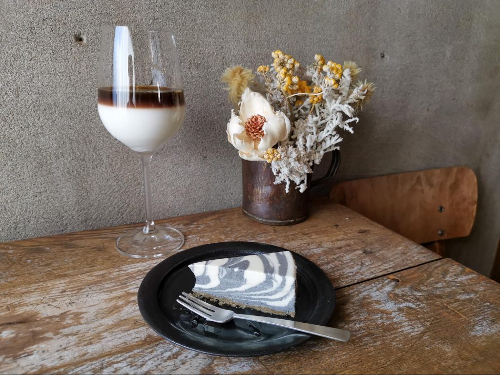 café glacé, a sweetened ice milk coffee that comes served in an elegant wine glass, along with the black sesame cheesecake that matches my leggings